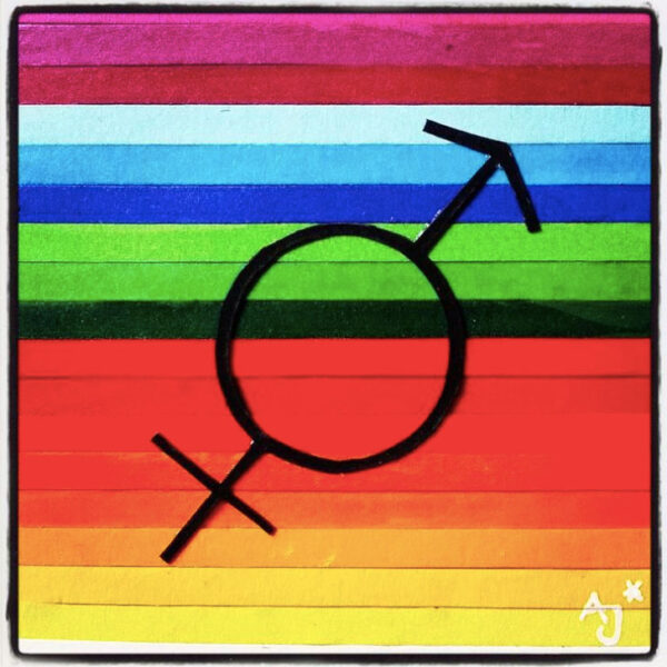 Kunst von Alex Jürgen*: ein schwarzes Geschlechtersymbol, das die Symbole von Frau und Mann vereint, im Hintergrund sind Regenbogenfarben. Das Bild besteht aus Papierstreifen.